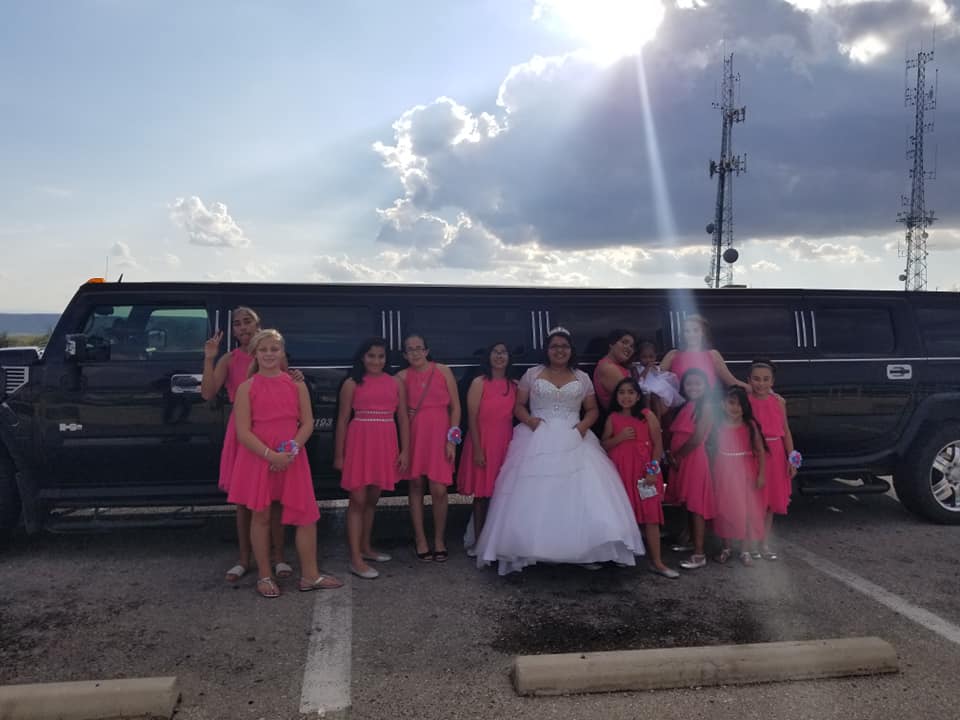 Quinceañera and bridesmaids in pink with the Hummer